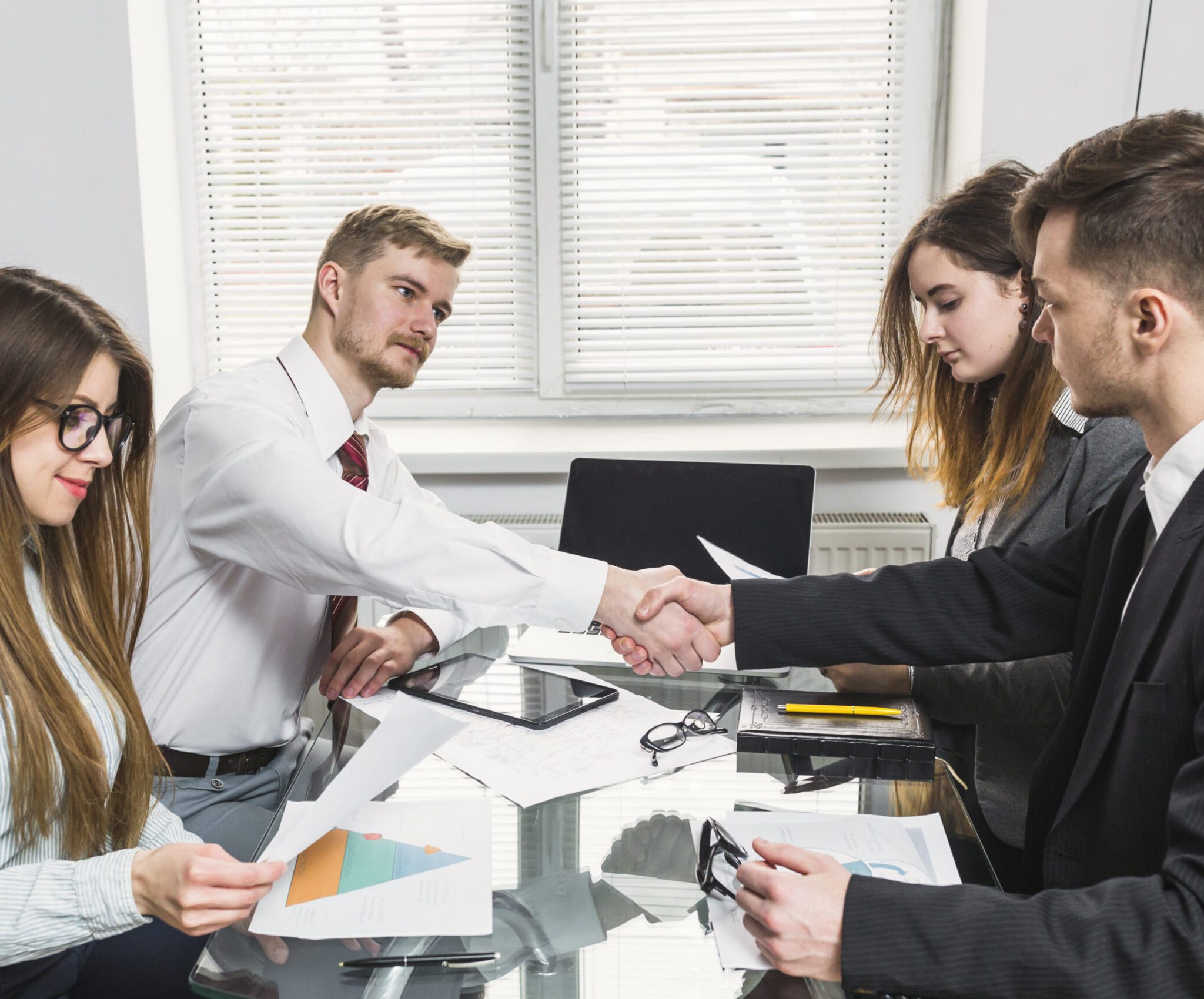 businessman-shaking-hand-with-his-colleague-office